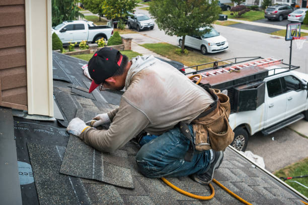 Professional Storm Damage Roof Repair technician working in Riverside, NY